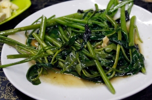 ผัดพักบุงไฟแดง, or stir-fried morning glory. In Vietnamese, the plant is called "rau mung." (Please excuse my lack of diacritics.)